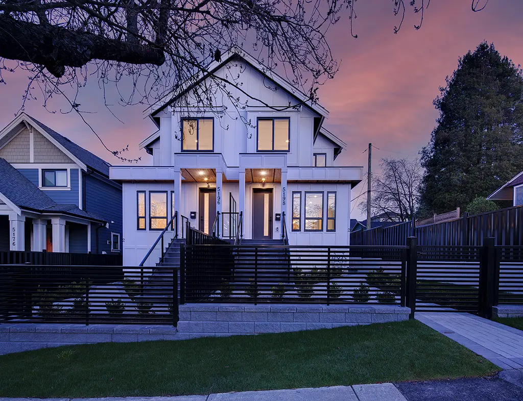 Residence II angled front exterior at twilight